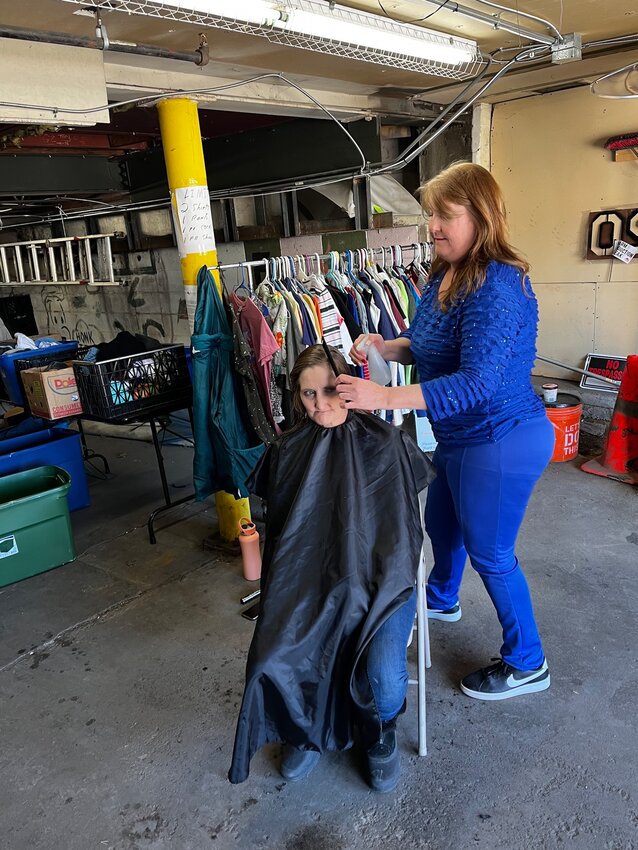 Lisa McCall, owner of the Barber Stop in Evergreen, wants volunteers to help her provide haircuts to Denver’s homeless population.